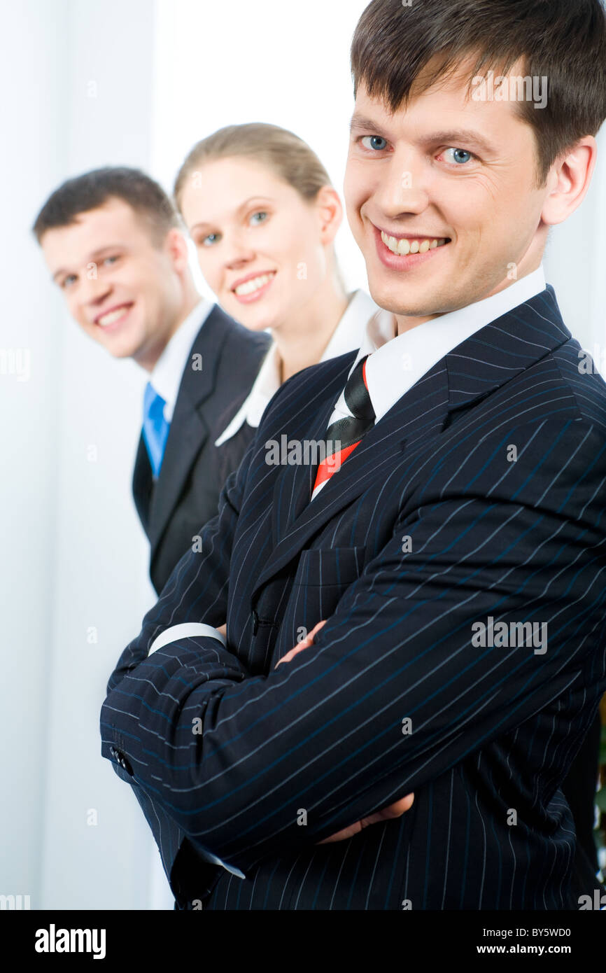 Row of successful business team with leader in front Stock Photo