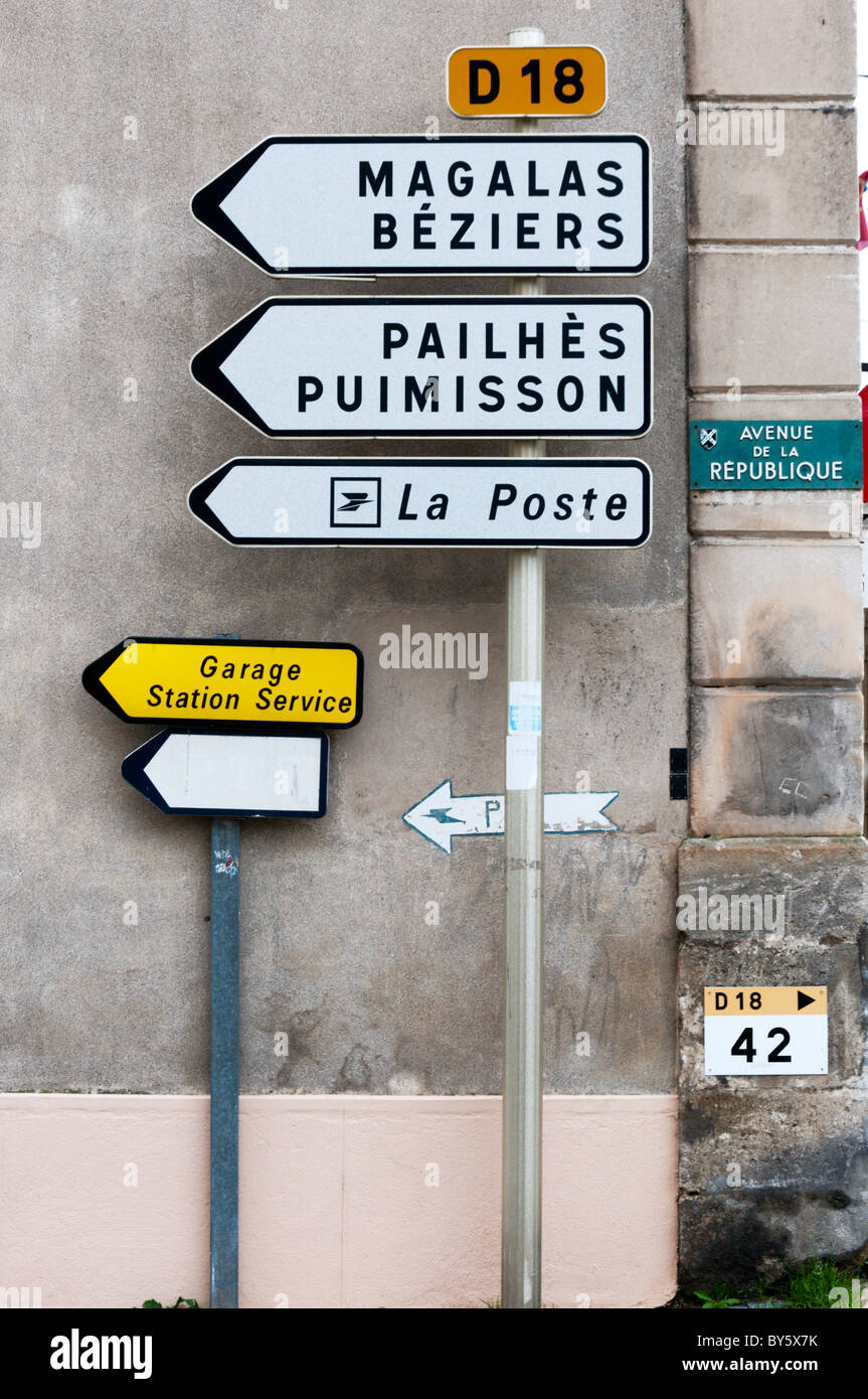 Direction road signs in the French village of St Genies de Fontedit. Stock Photo