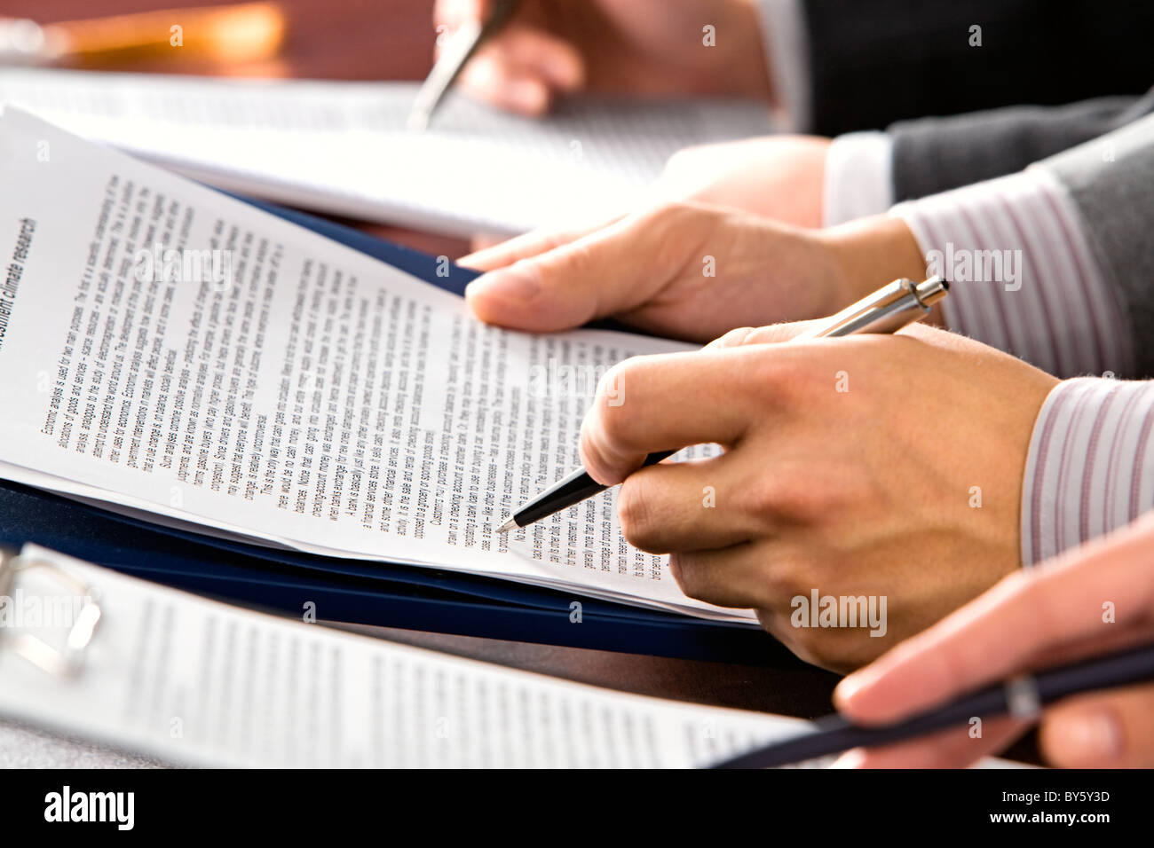 Image of people’s hands making notes in lecture Stock Photo - Alamy