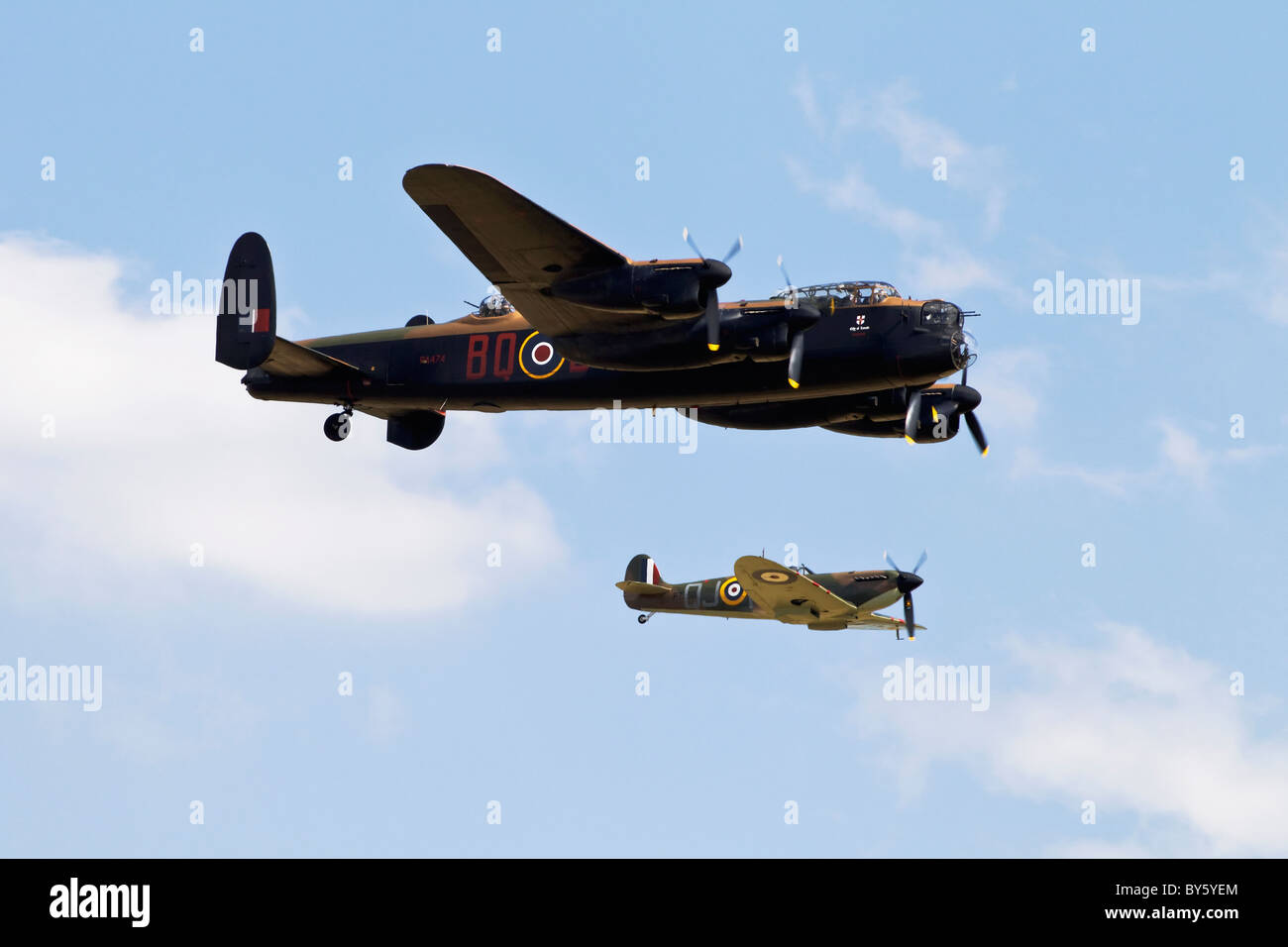 An Avro Lancaster and Vickers Supermarine Spitfire of the Battle of Britain Memorial flight in close formation Stock Photo