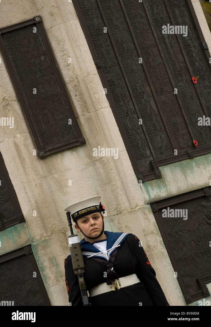 a female sea cadet stand guard at the Cenotaph during remembrance day , central park , east ham Stock Photo