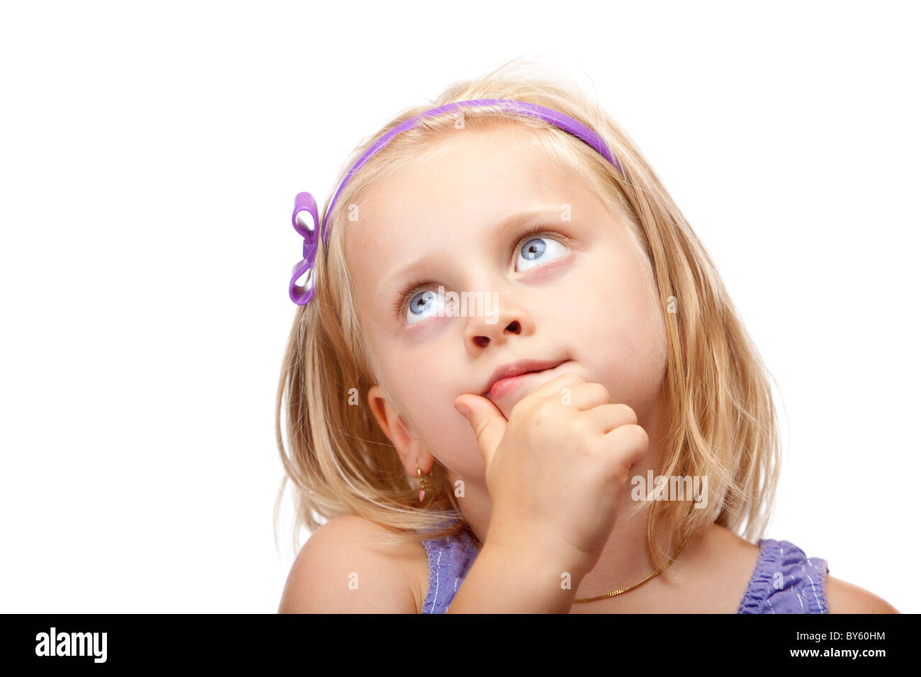 Contemplative young girl  looks up. Isolated on white background. Stock Photo