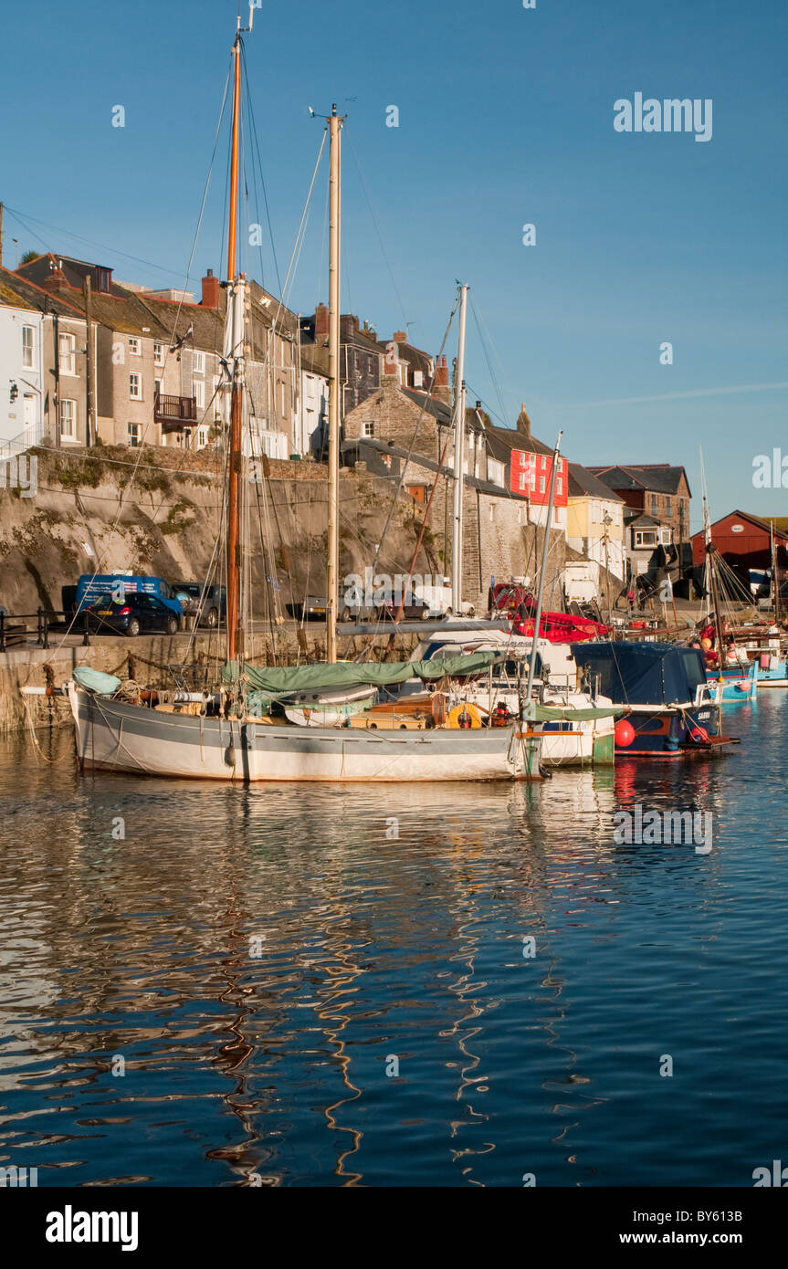 Mevagissey Harbour in late winter afternoon sunshine in Cornwall West of England UK Stock Photo