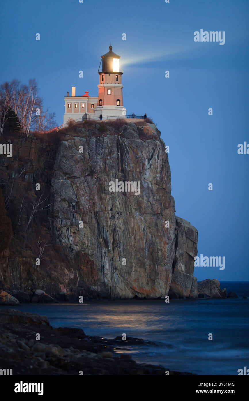 Split Rock Lighthouse on the North Shore of Lake Superior shining at night. Stock Photo