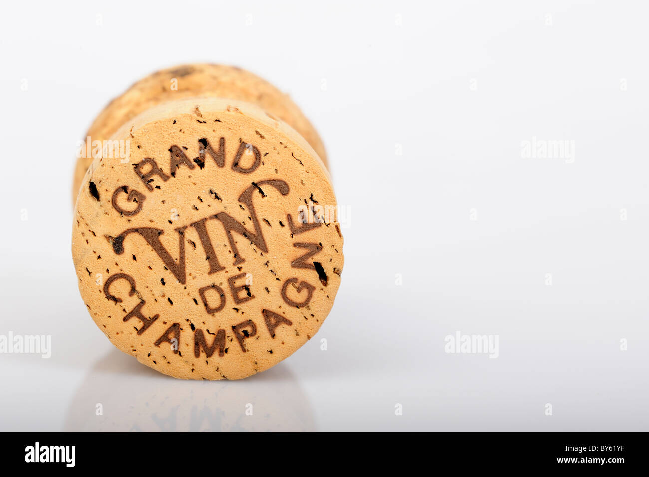Stock photo of a champagne cork shot against a white background. Stock Photo