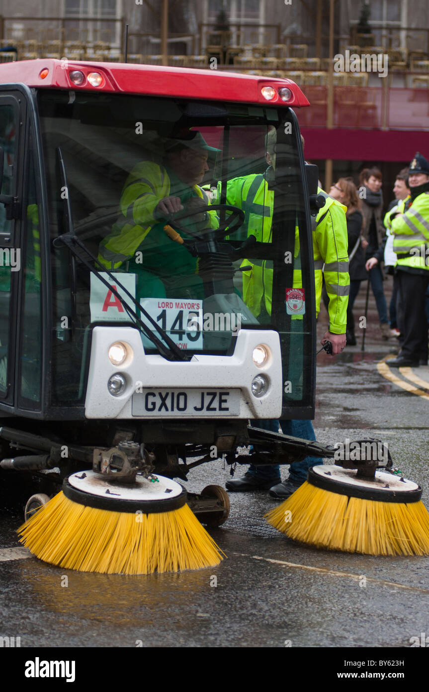 A street cleaning vehicle with driver at work in the city of London