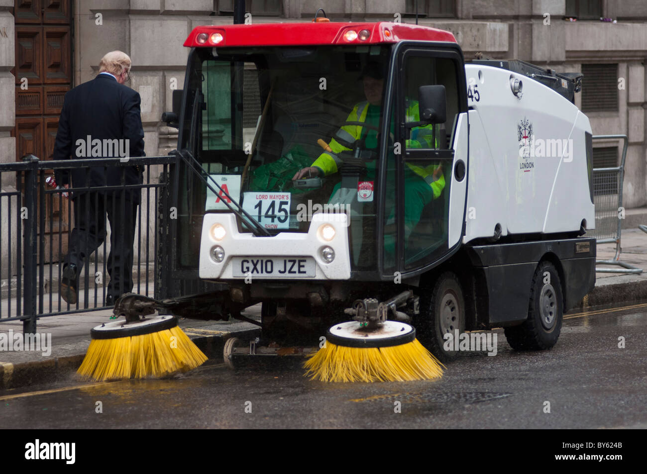 A street cleaning vehicle with driver at work in the City of London