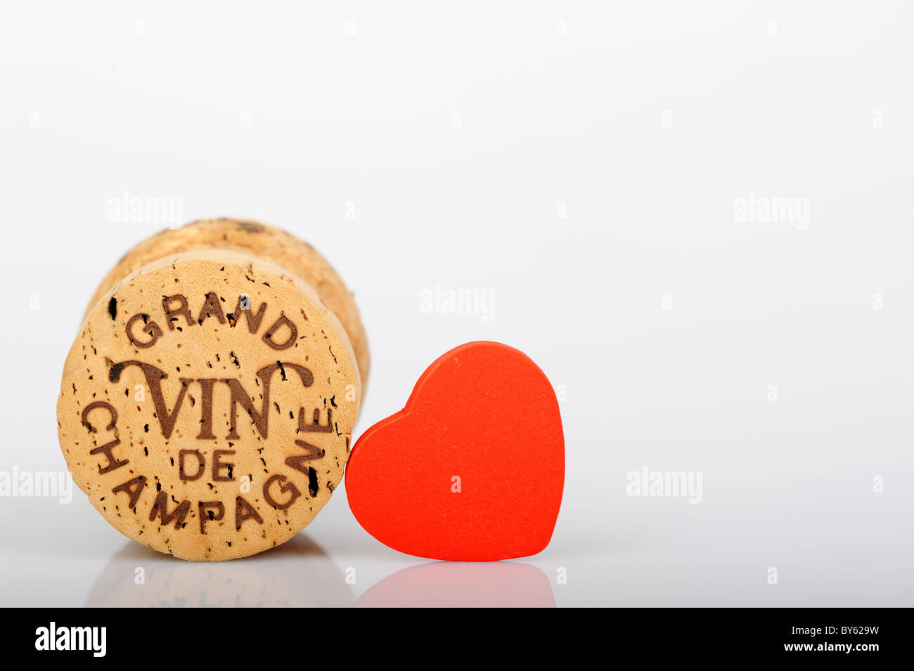 Stock photo of a champagne cork shot against a white background. Stock Photo