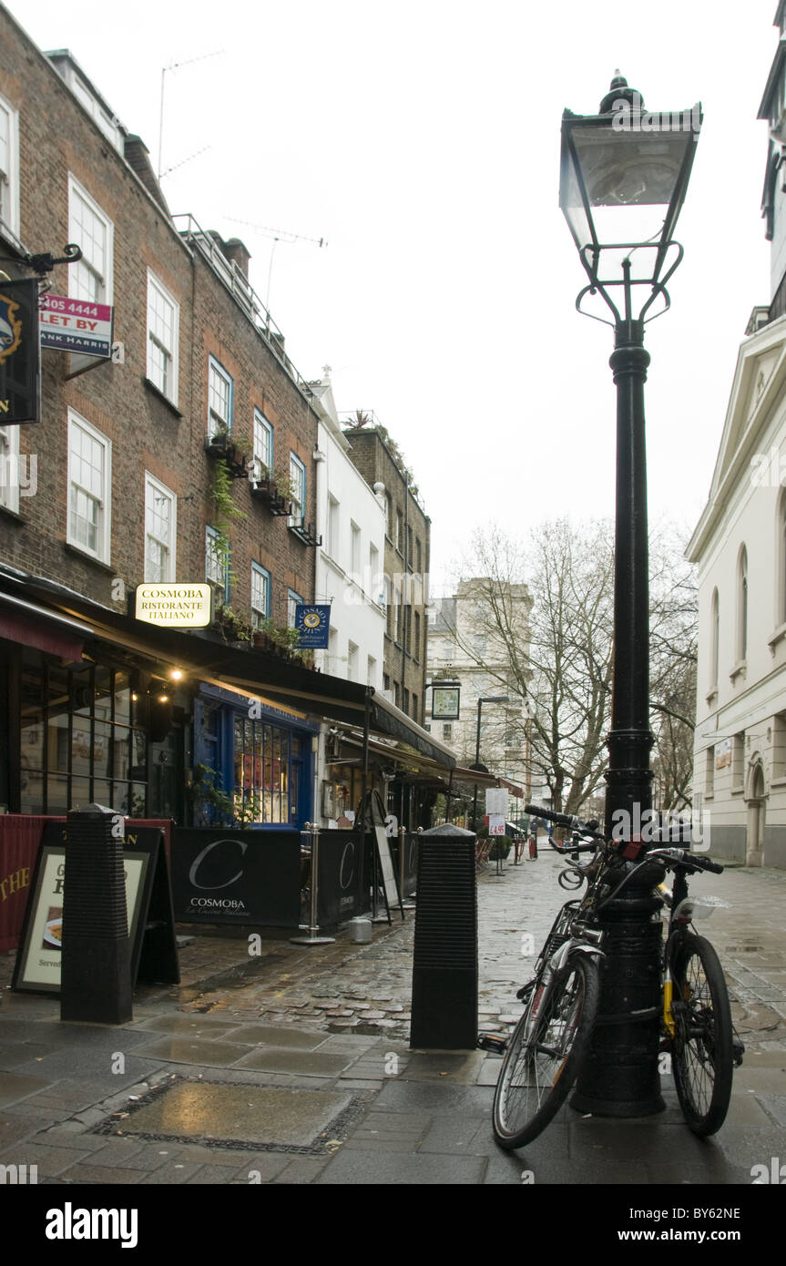 Old London street scene with bicycles and old lamppost Stock Photo