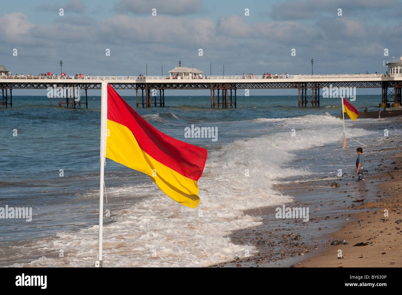 Red and yellow beach flag indicating a safe place to swim at Cromer