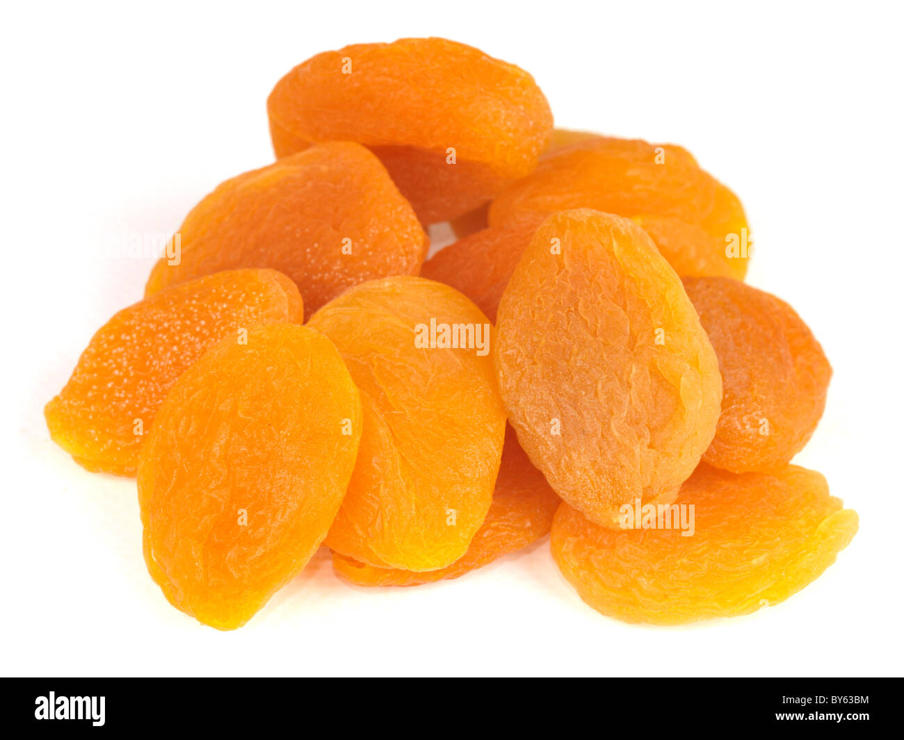 A Handful Or Stack Of Healthy Dried Apricots Fruit Snack Against A White Background With No People And A Clipping Path Stock Photo