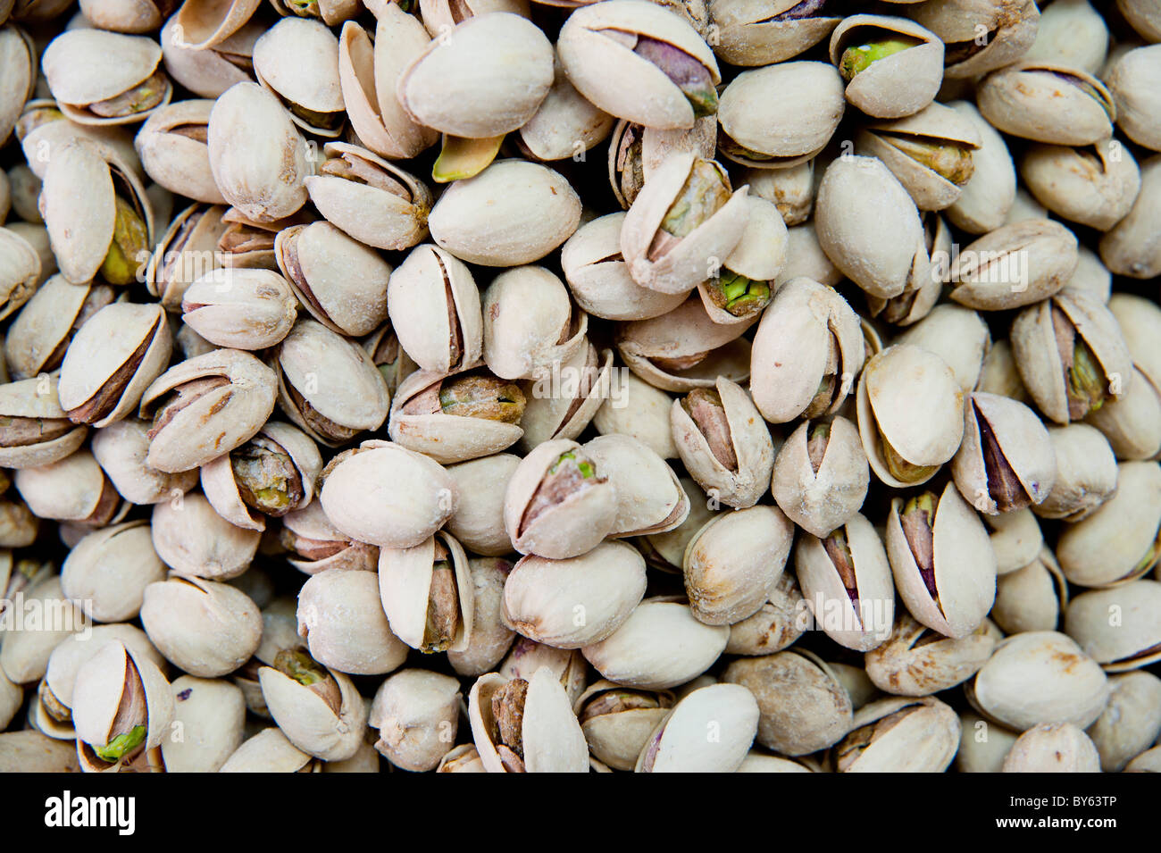A pile of freshly roasted pistachio nuts Stock Photo