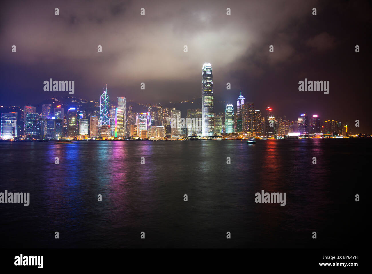 The amazing Hong Kong skyline at night from Kowloon lights glowing on ...
