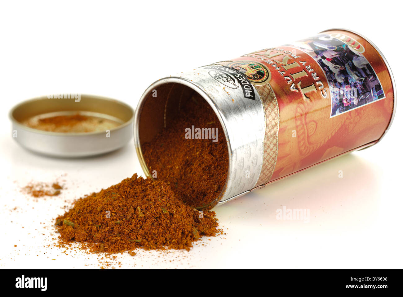 Container of Fiddes Payne authentic Tikka curry powder spilling onto a