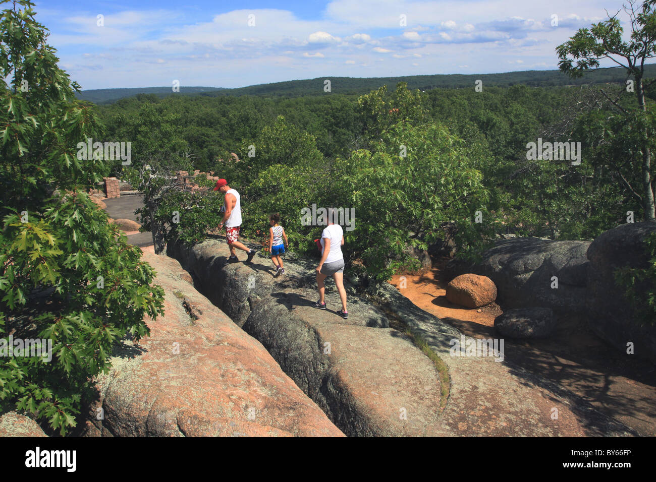 family hiking Elephant Rocks State Park Missouri granite Stock Photo