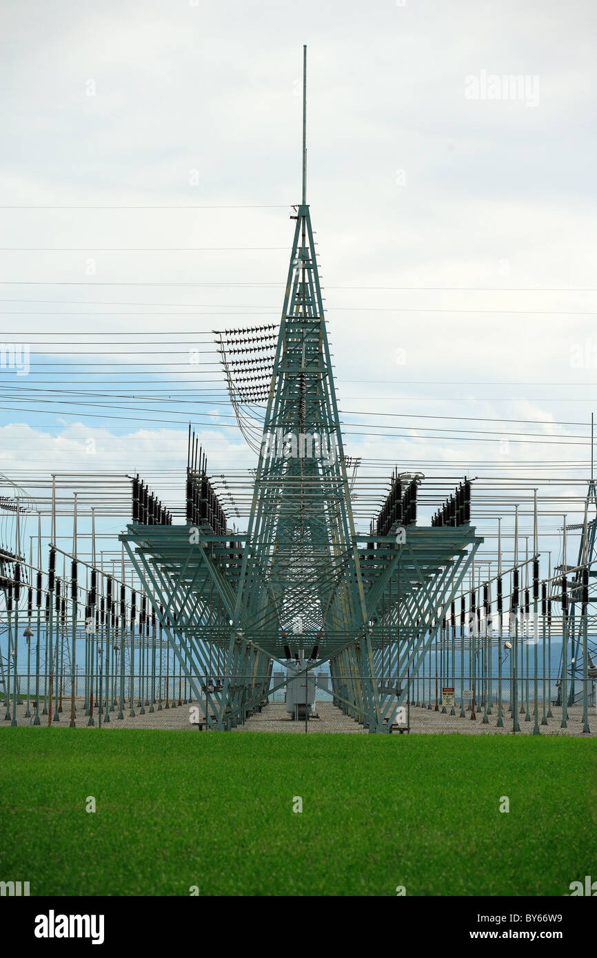 A view of an electrical substation, with repetitive patterns of framework, insulators and transformers. Stock Photo