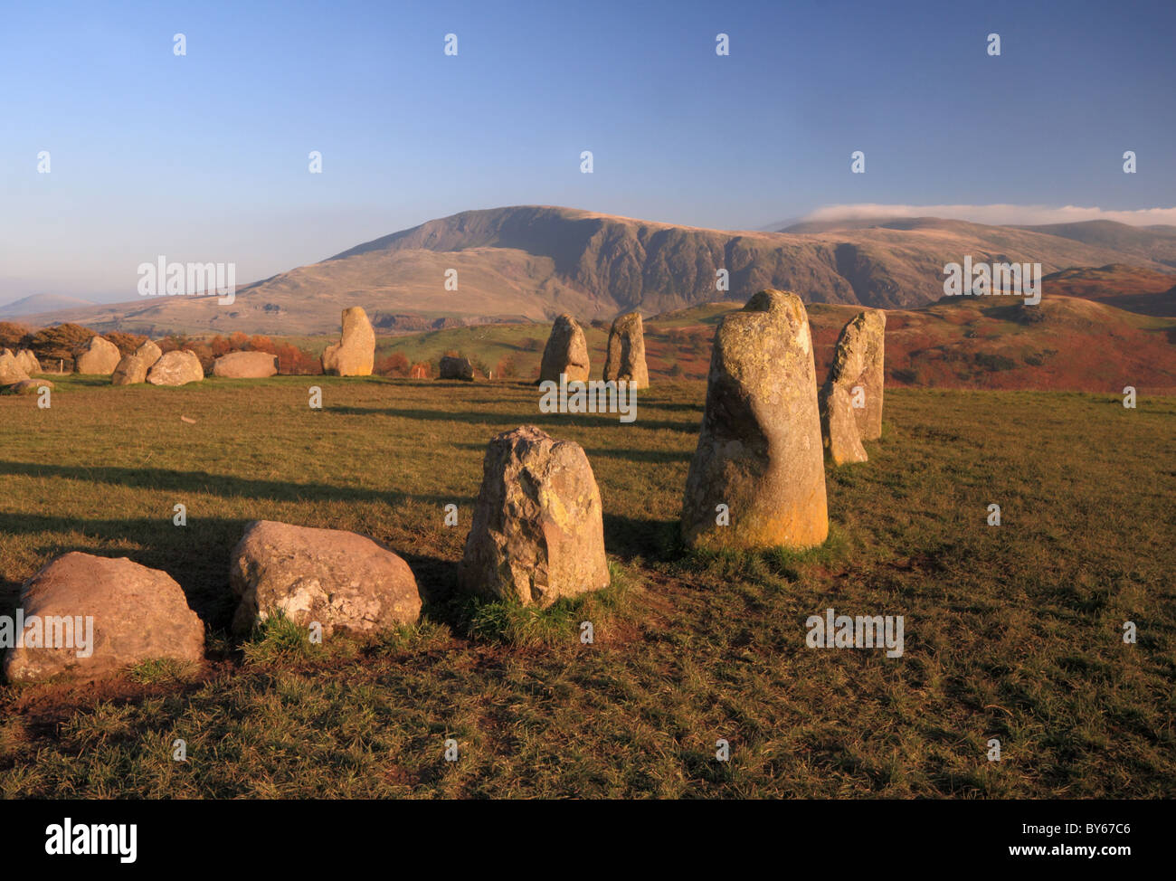 A view across Castlerigg Stone Circle in the Lake District to the mist shrouded Fells beyond Stock Photo