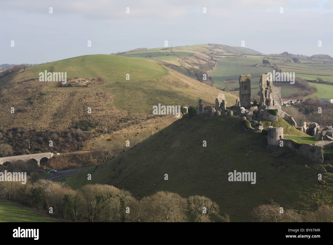 Corfe Castle in January with blue sky. Iconic hill castle destroyed by Oliver Cromwell in 1645. Gateway to Purbeck in Dorset Historical importance Stock Photo