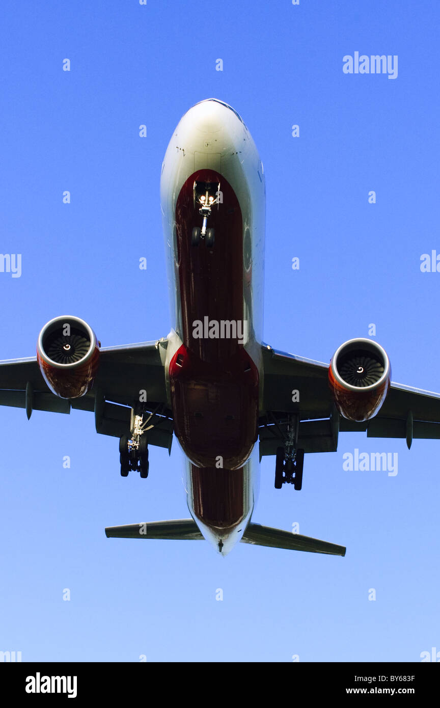 Low flying Boeing 777 operated by Air India on final approach for landing at London Heathrow Airport Stock Photo