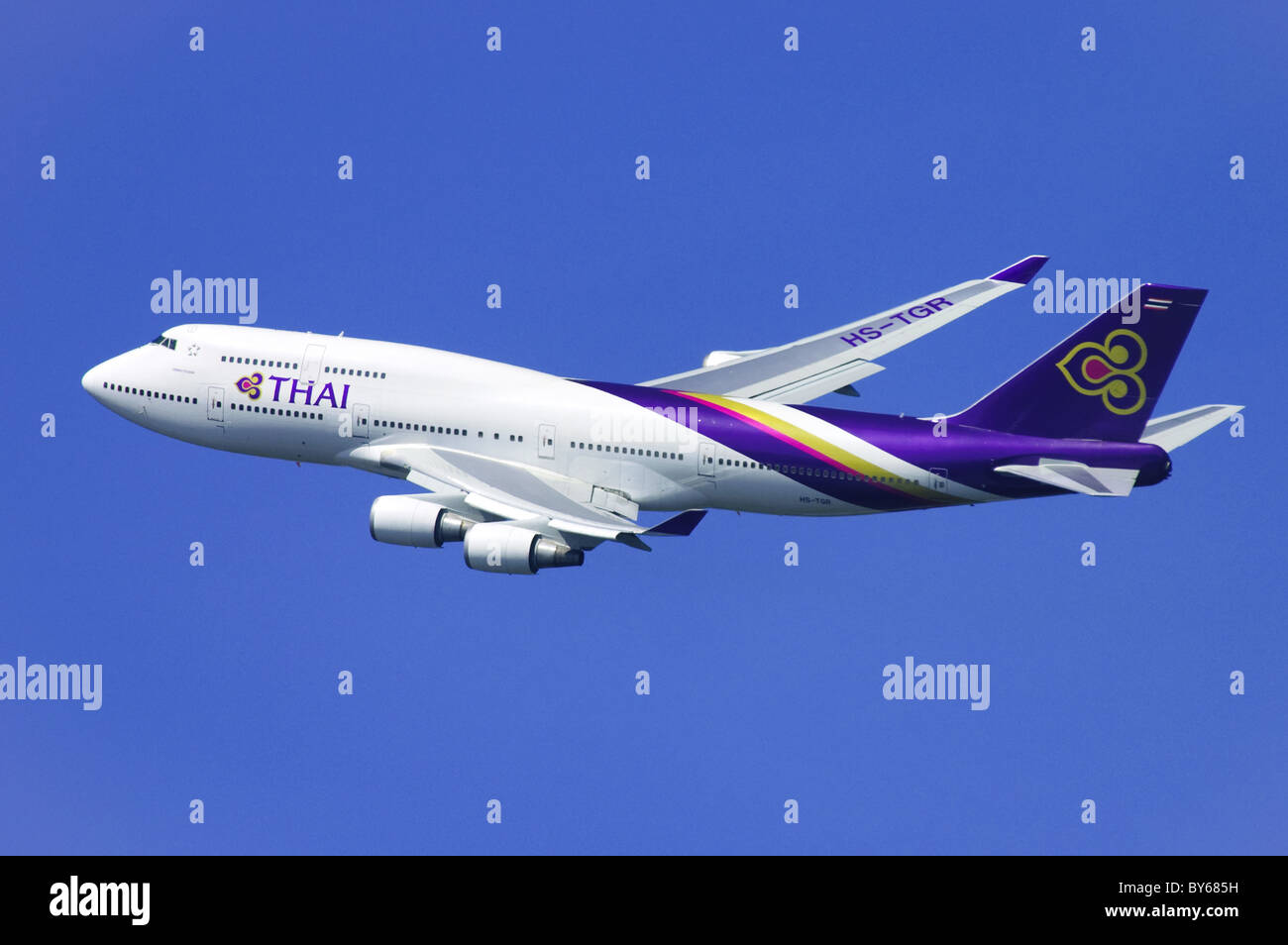 Boeing 747 operated by Thai Airways climbing out after take off from London Heathrow Airport Stock Photo