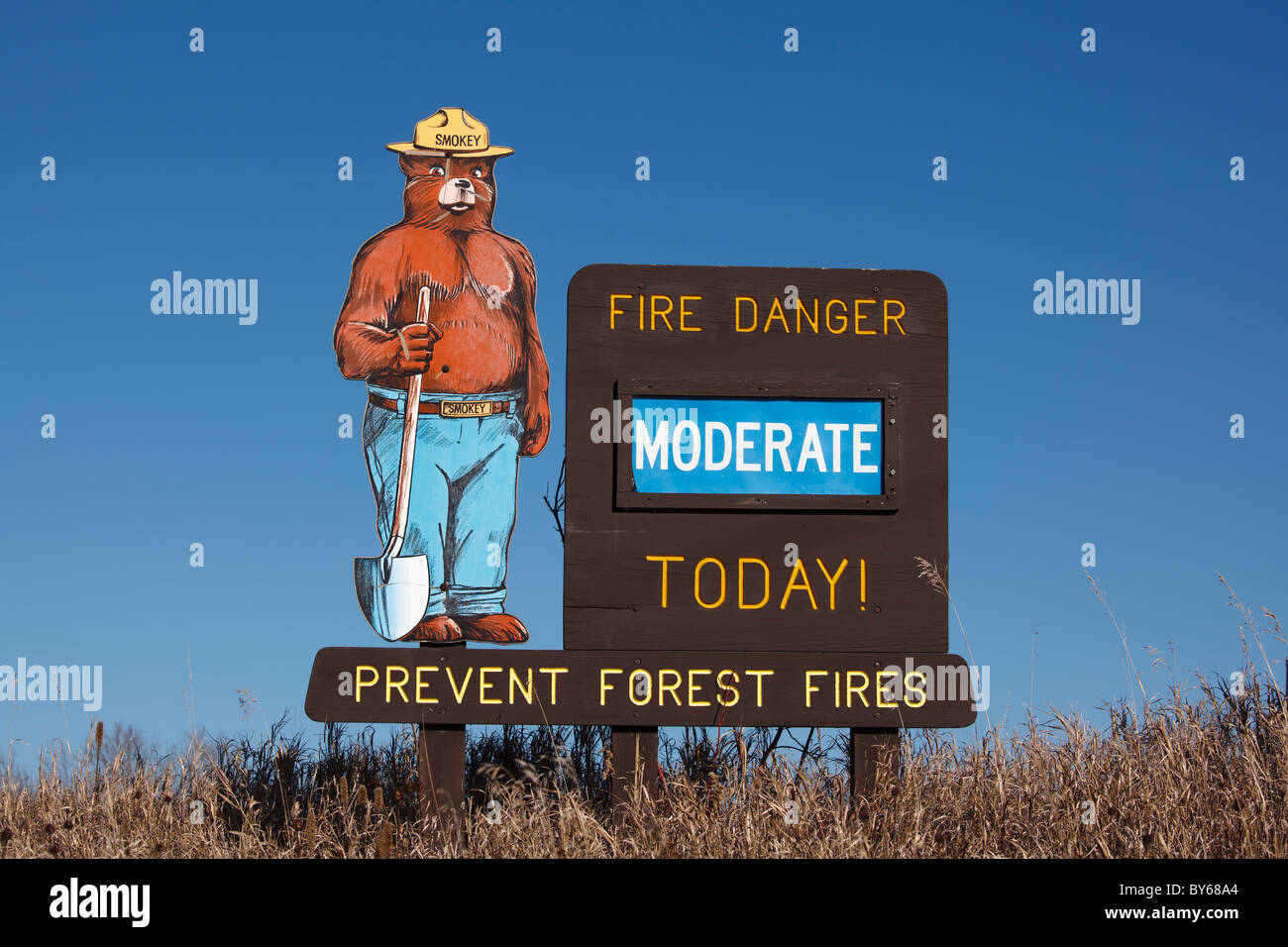 A Smokey the Bear fire danger sign showing 'moderate' risk - northern Minnesota, USA. Stock Photo