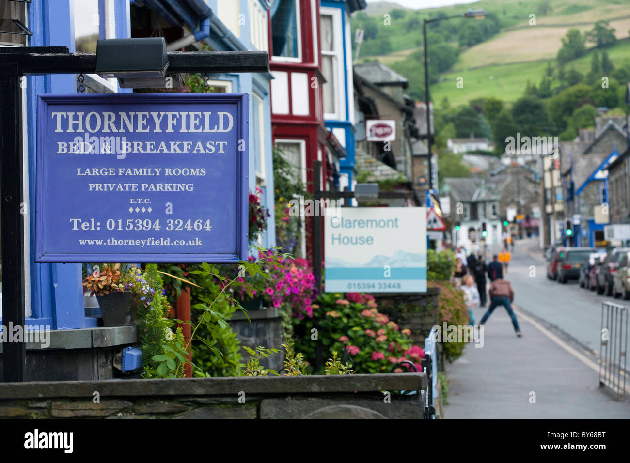 A bed and Breakfast sign marks the start of a road full of accomodation in Ambleside in the Lake District Stock Photo
