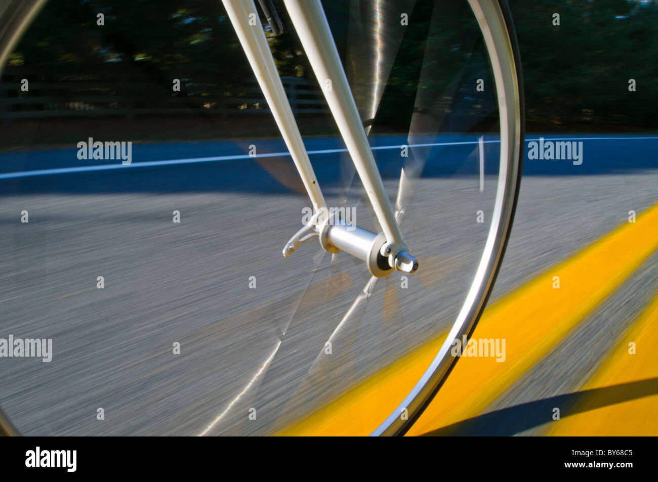 Rolling bicycle wheel Stock Photo Alamy