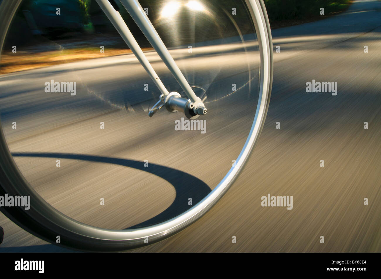 Rolling bicycle wheel Stock Photo Alamy
