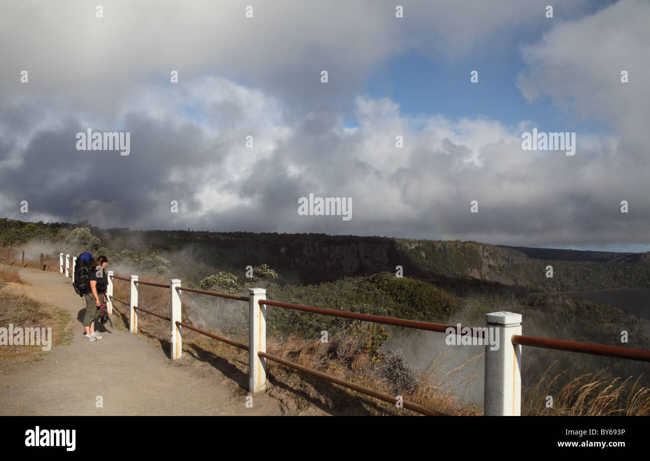 Backpacker by steaming bluff at Hawaii Volcanoes National Park on the