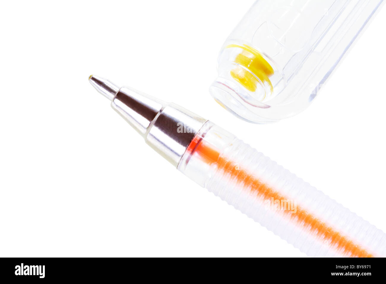 Closeup of yellow ballpoint pen and cap isolated on white Stock Photo