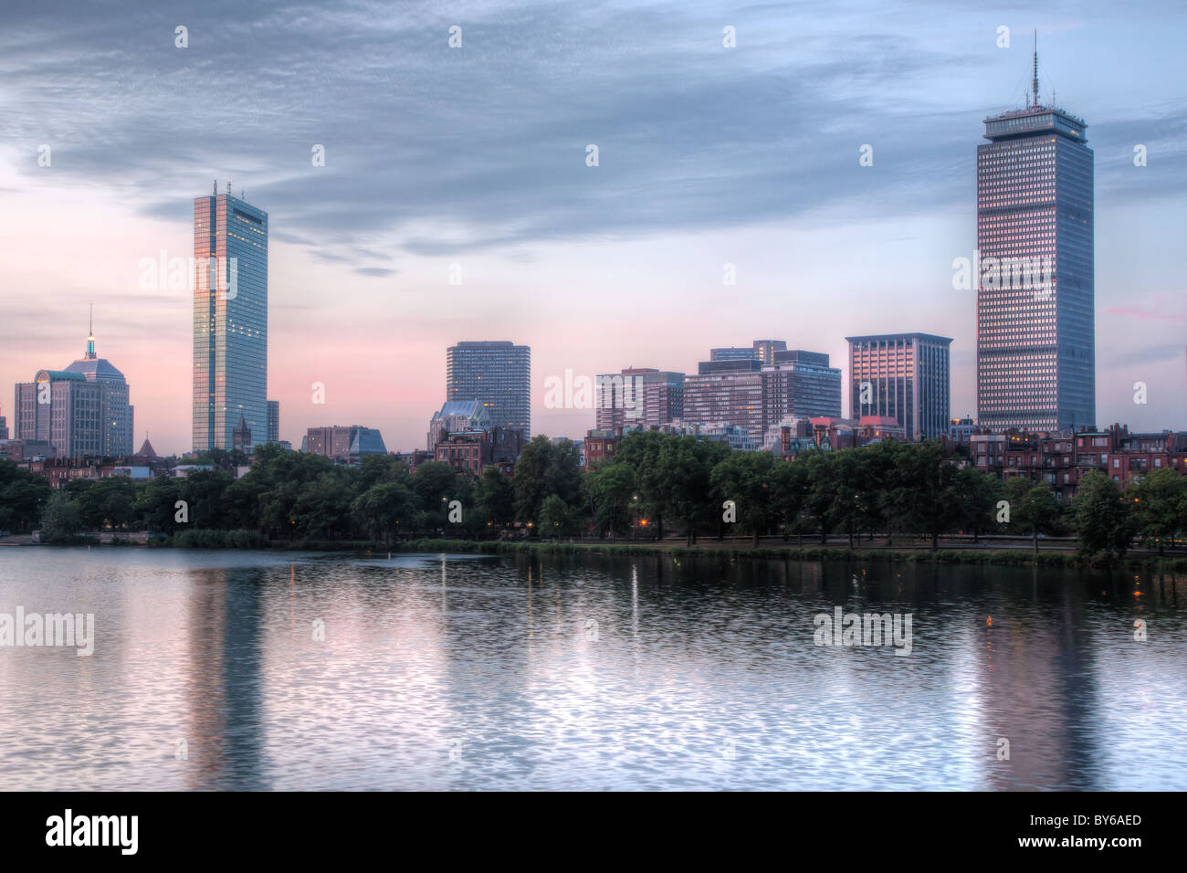 The Boston skyline including the John Hancock and Prudential Center viewed over the Charles River at twilight in Boston, Massachusetts. Stock Photo