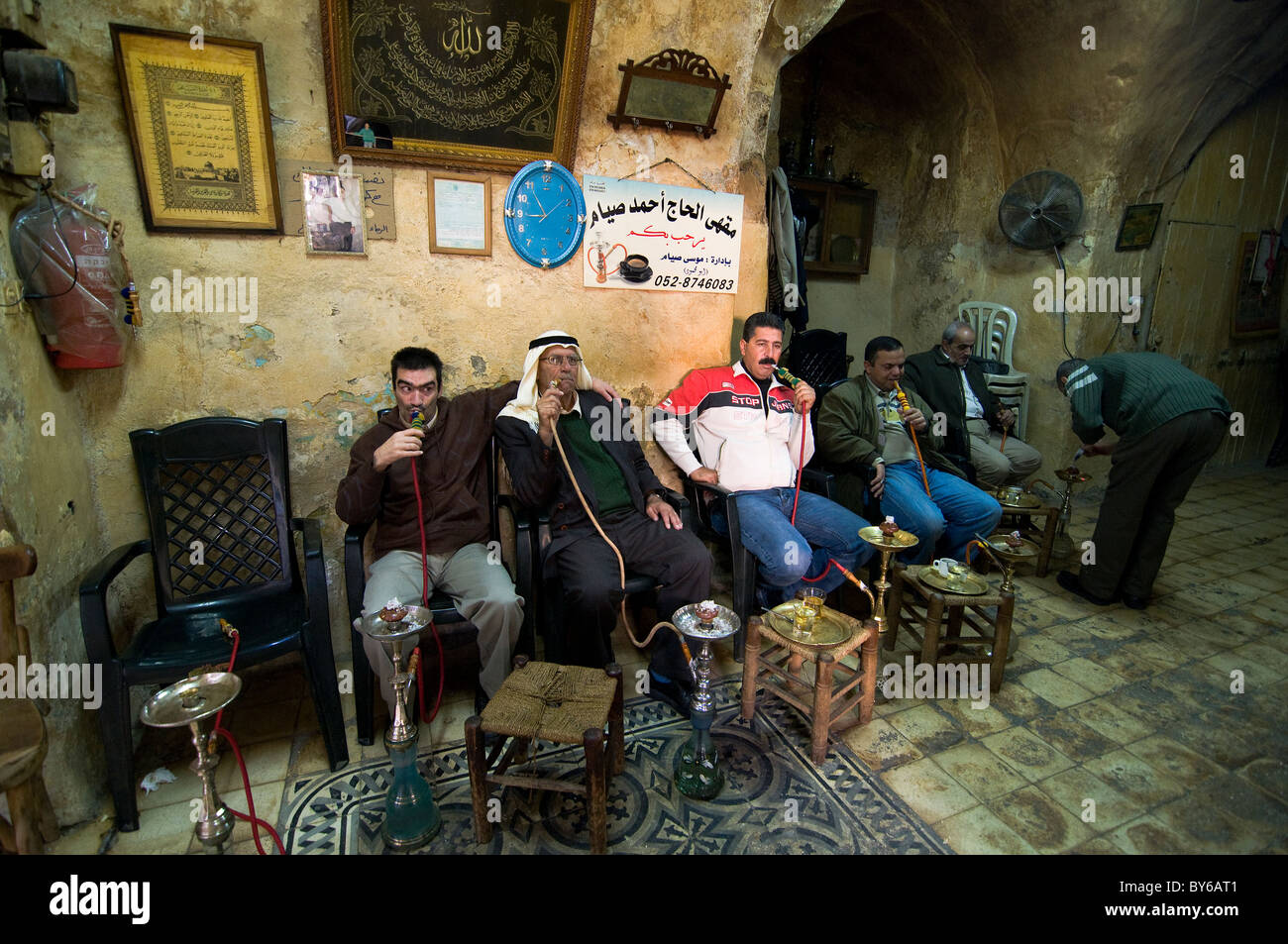 Palestinian men smoking Nargilas at a tea house in the old city of Jerusalem. Stock Photo