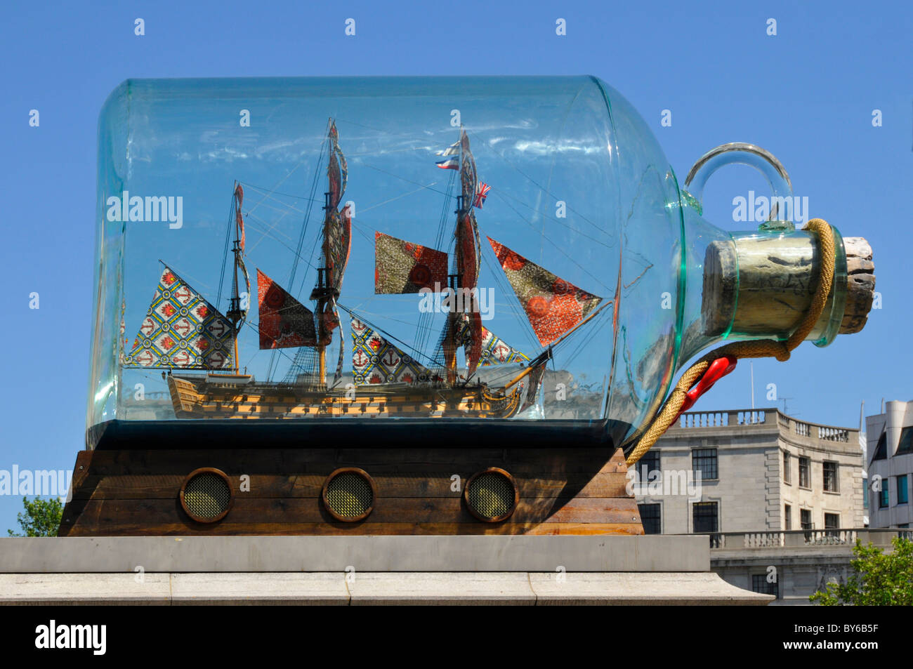 Close up of art model of Nelsons flagship Victory in a bottle by Yinka Shonibare artwork on fourth plinth in Trafalgar Square London England UK Stock Photo