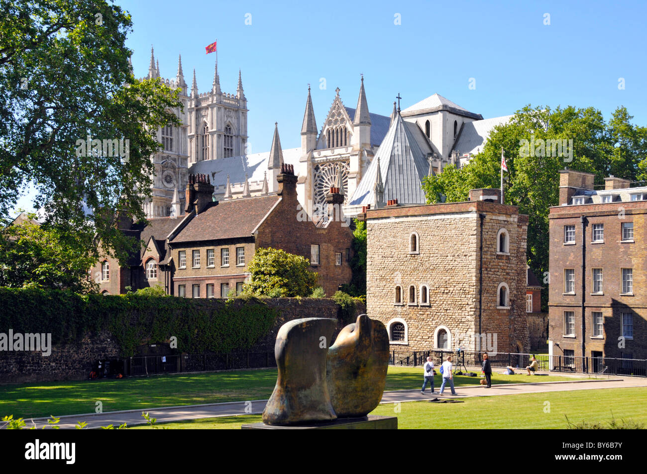 Sculptor Henry Moore bronze abstract modern art sculpture Knife Edge Two Piece in College Green Park Jewel Tower & Westminster Abbey beyond London UK Stock Photo
