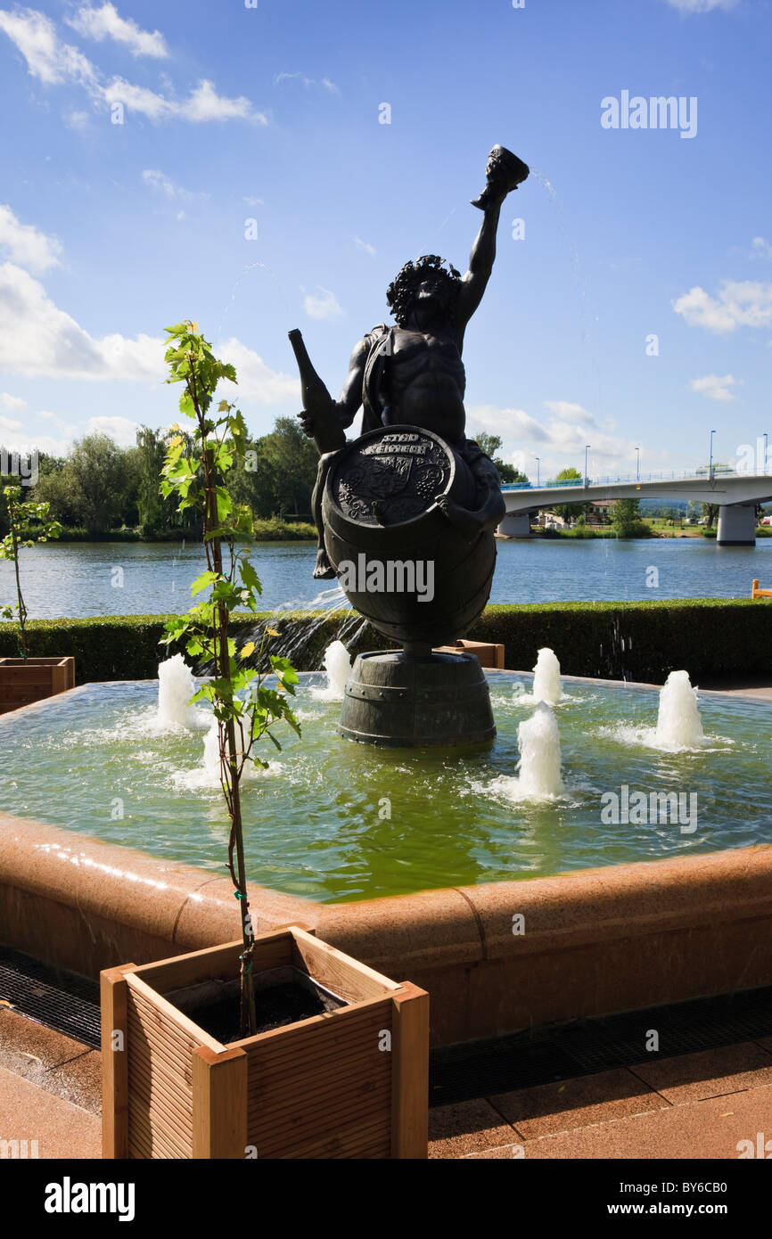 Bacchus statue on Moselle River esplanade on German border. Remich, Grand Duchy of Luxembourg, Europe. Stock Photo