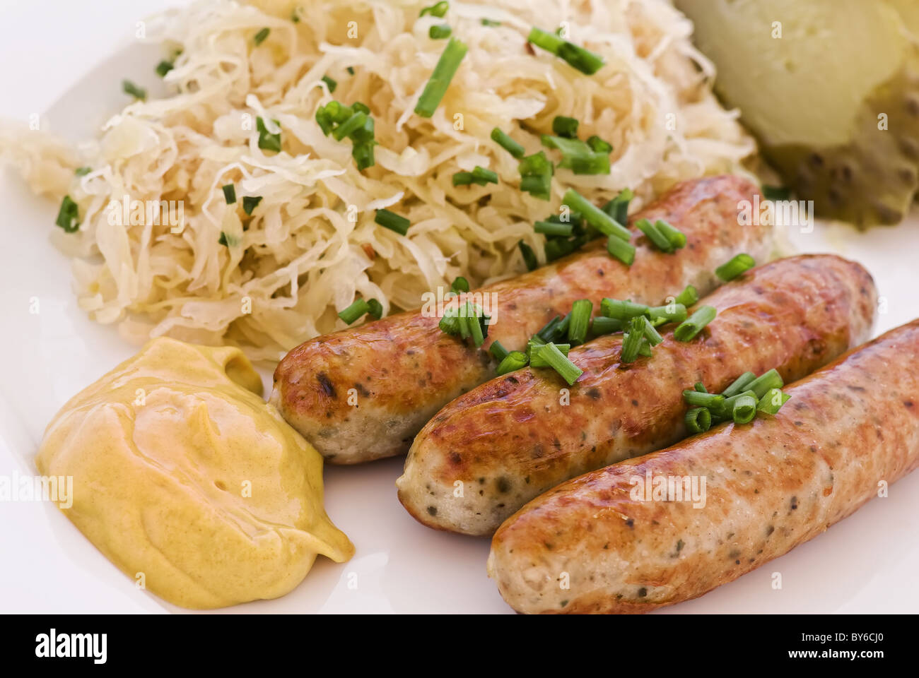 German grilled sausage with sauerkraut Stock Photo Alamy