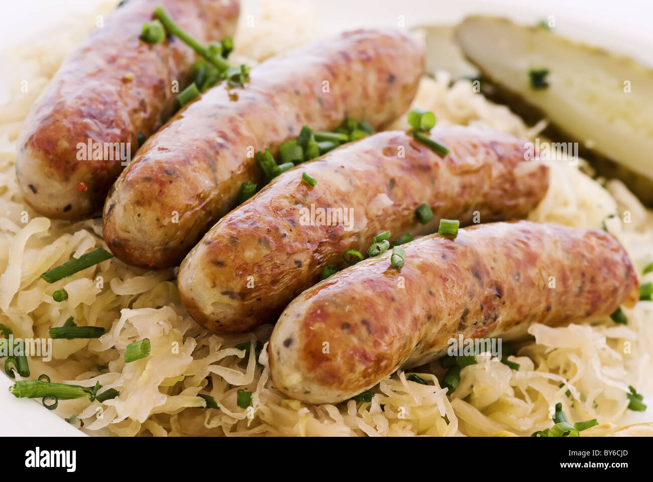 German grilled sausage with sauerkraut Stock Photo Alamy