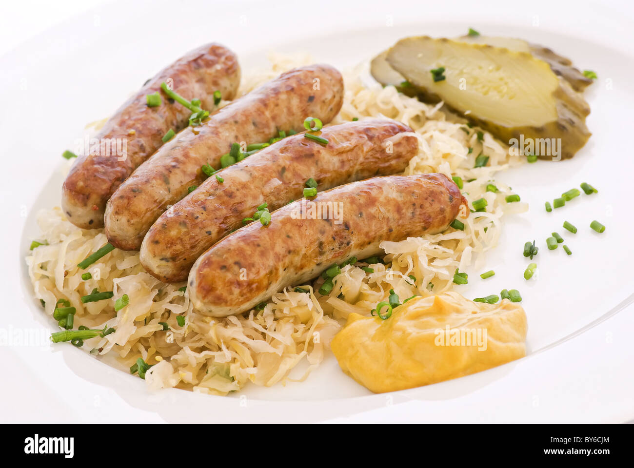 German grilled sausage with sauerkraut Stock Photo Alamy