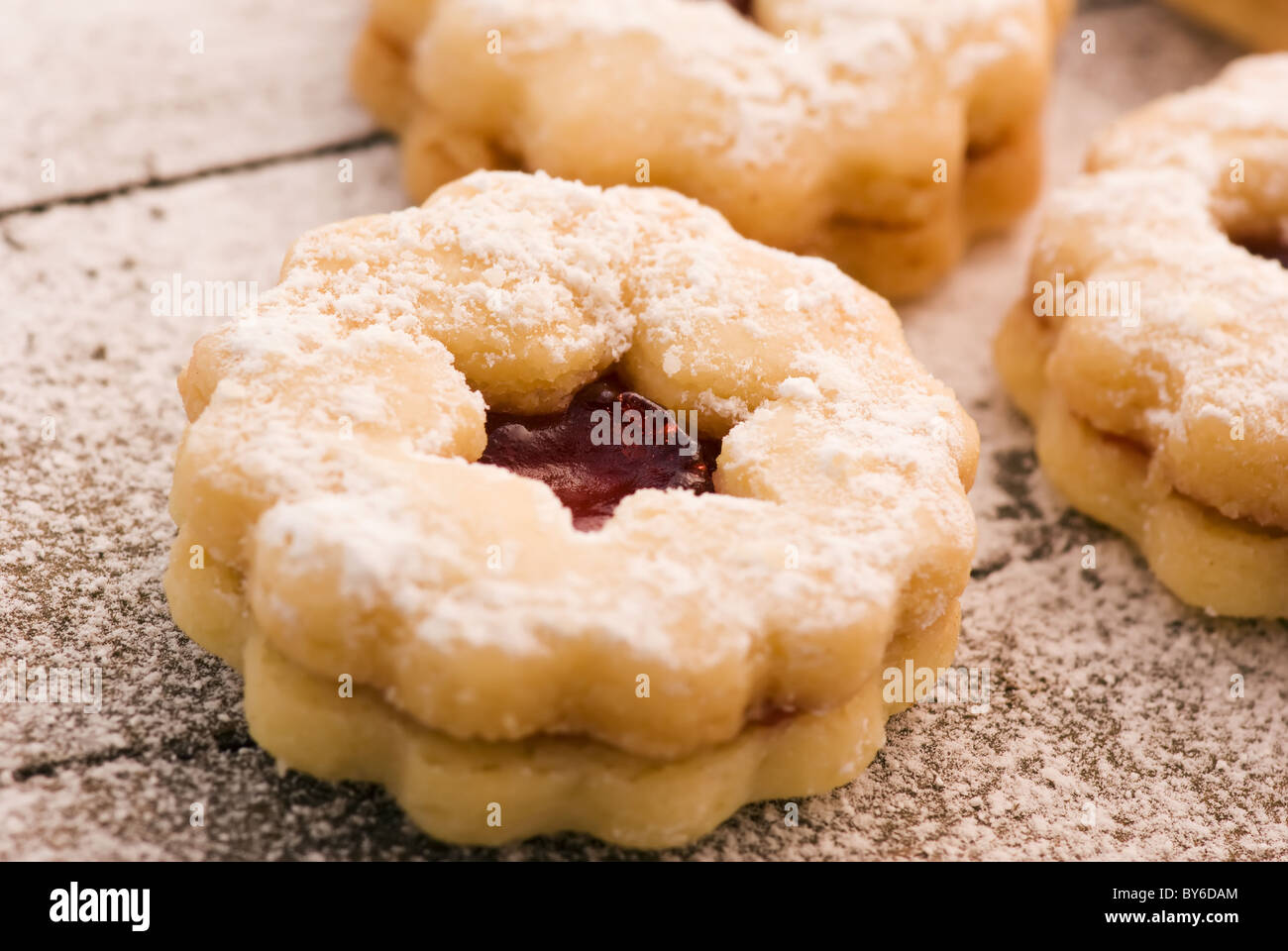 Christmas Cookies with icing sugar as closeup on old wood. Stock Photo