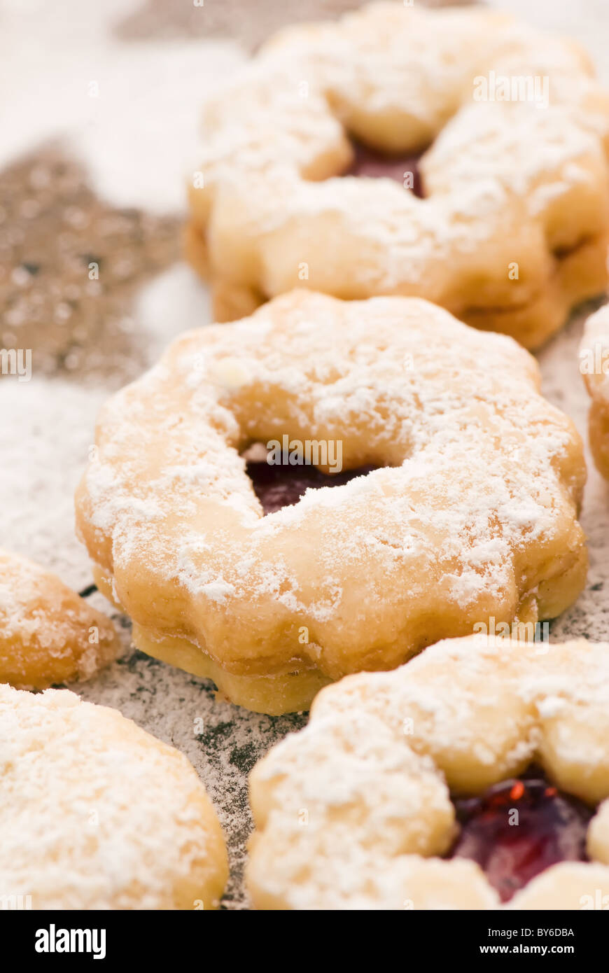 Christmas Cookies with icing sugar as closeup on old wood. Stock Photo