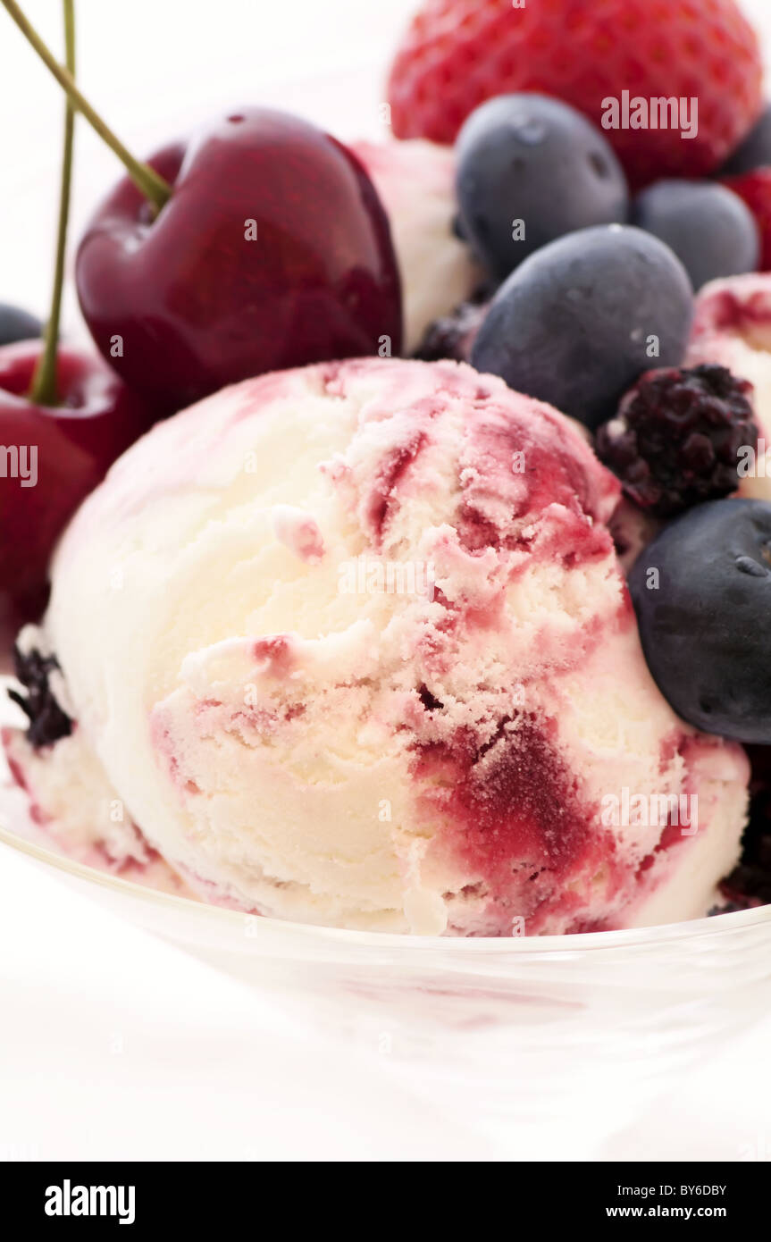 Scoop of ice cream with fresh fruits as closeup Stock Photo