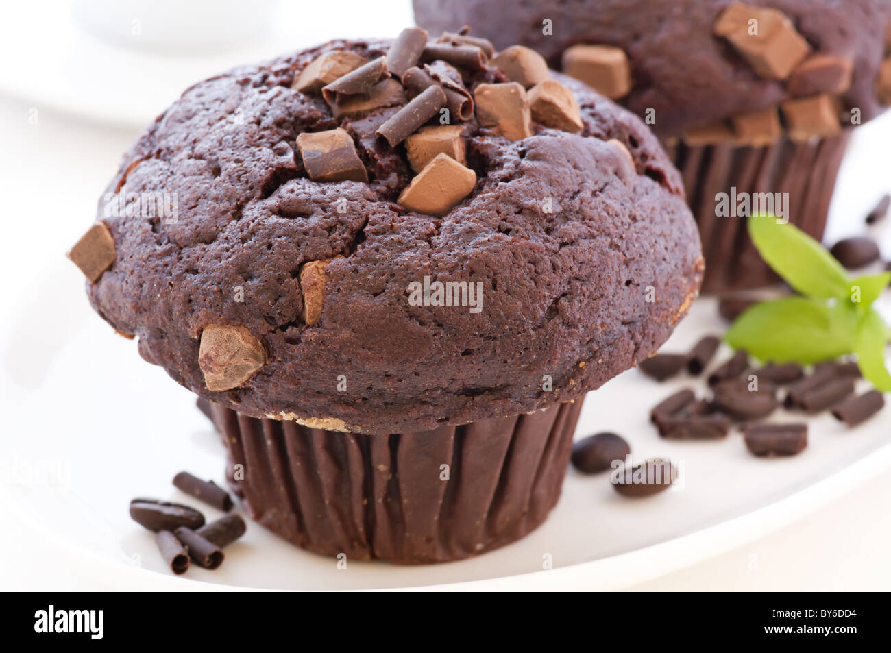 Chocolate muffin as closeup on white background Stock Photo - Alamy