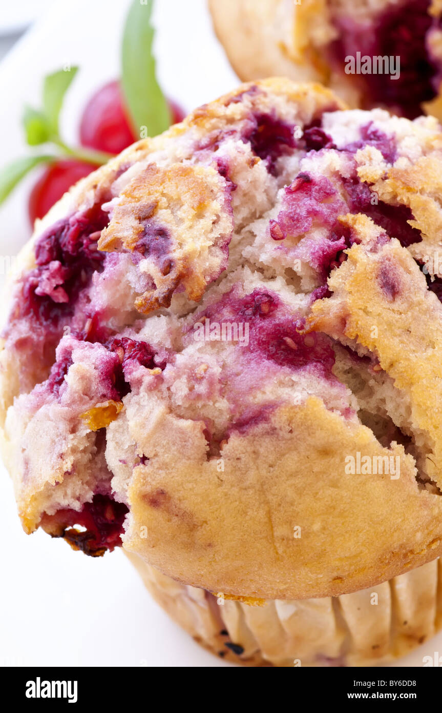 Raspberry muffin as closeup on white background Stock Photo