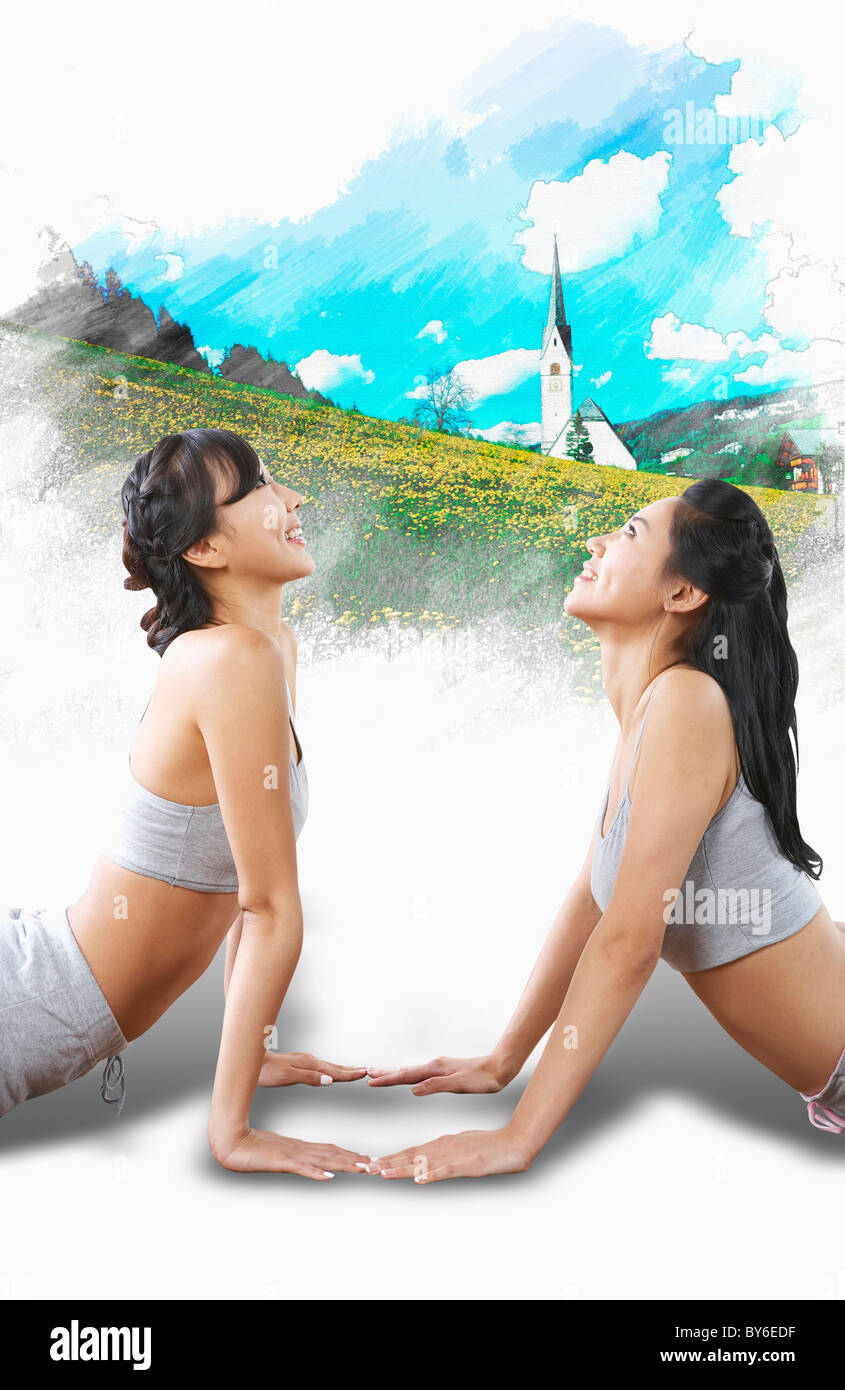 women exercising yoga together Stock Photo