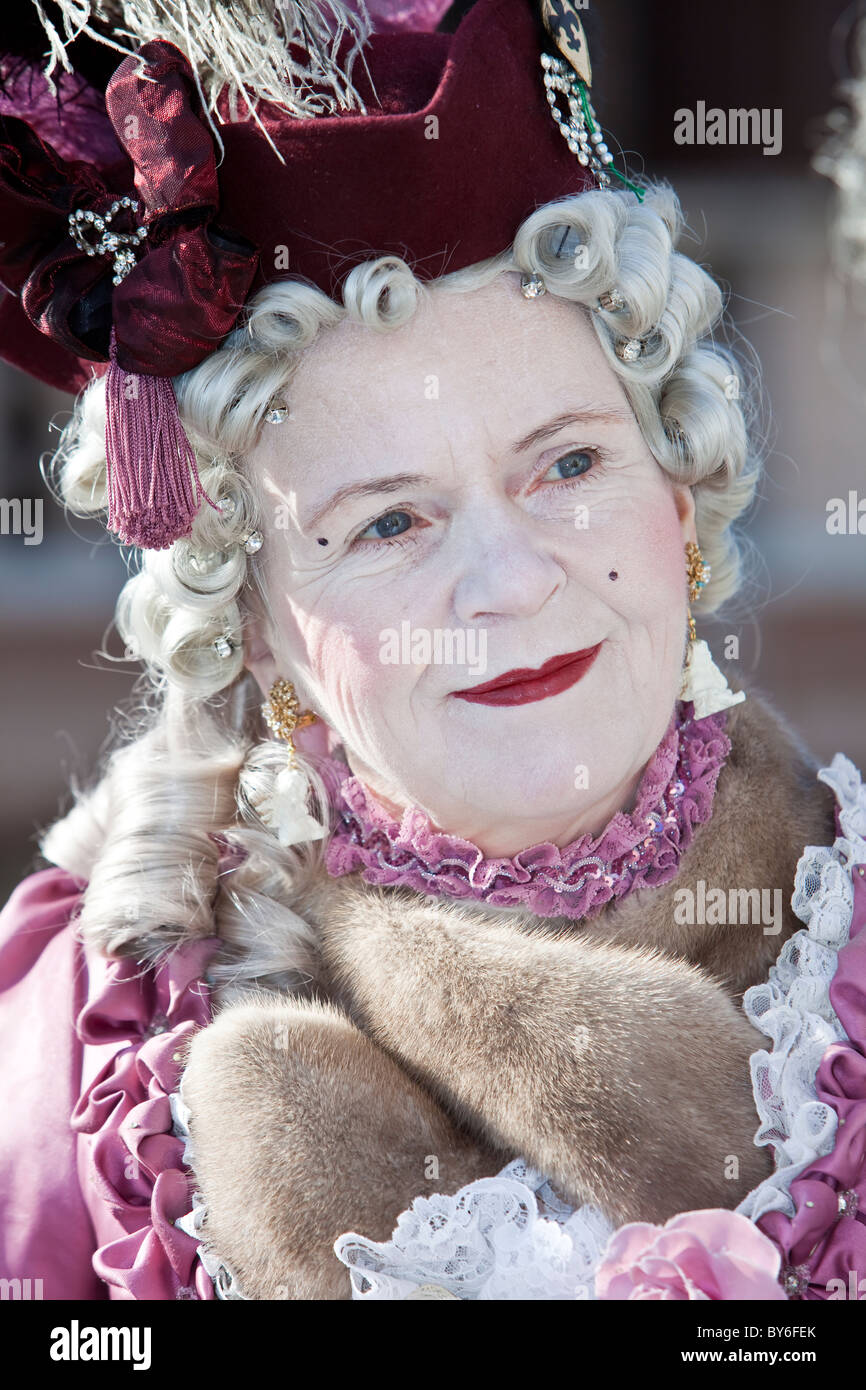 Person in a costume but with no mask at the Venice Carnival, Italy Stock Photo