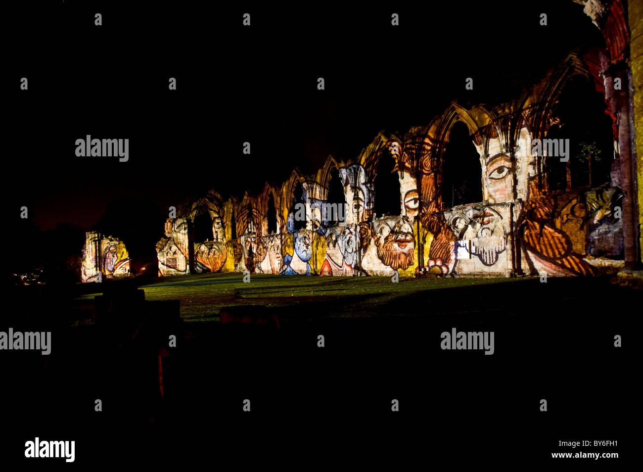 Medieval artwork projected onto the ruins of St Mary's Abbey at night. Stock Photo