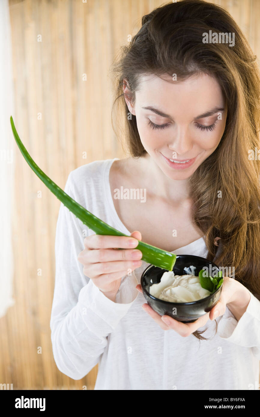 Young woman preparing aloe vera facial Stock Photo