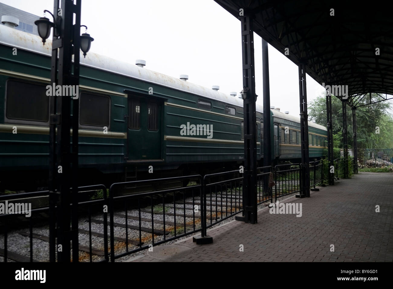 old train station and passenger train Stock Photo