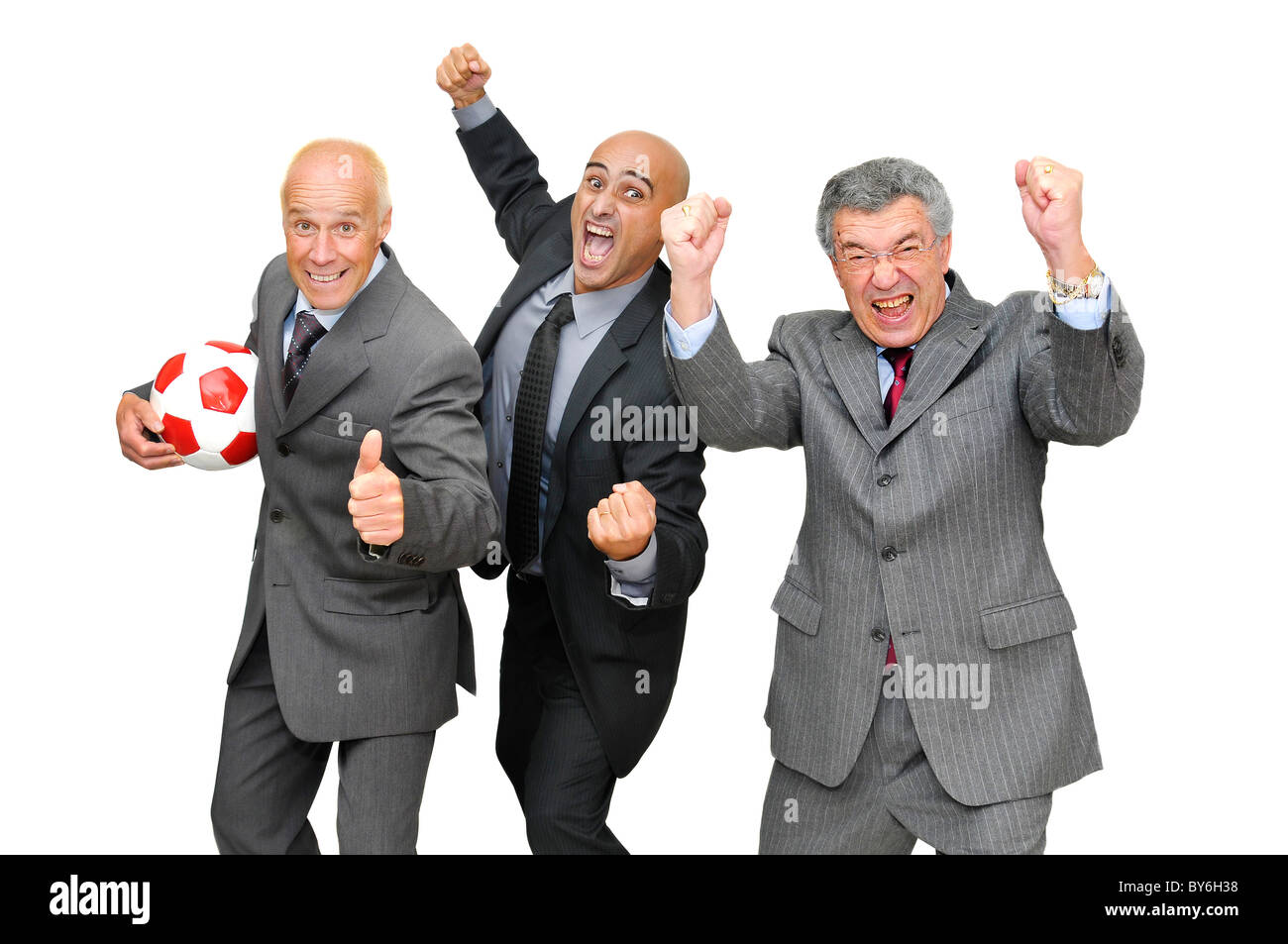 Happy businessmen celebrating with a soccer ball isolated in white Stock Photo