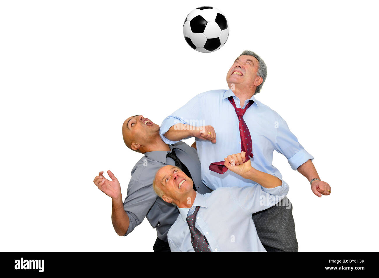 Group of businessmen playing soccer isolated in white Stock Photo